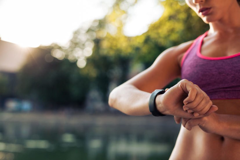 Woman Looking At Her Fitness Tracker Without Bluetooth.